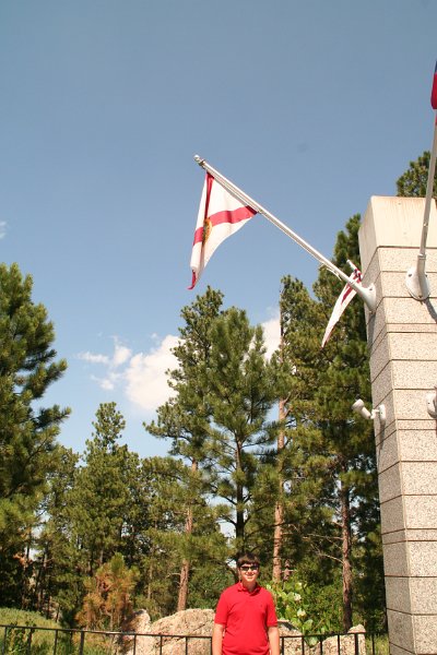 Trip (242).JPG - Kris standing under the Florida (his birth state) flag at Mount Rushmore National Memorial